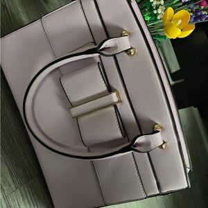 Beautiful light lavender handbag with strap